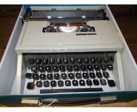 VINTAGE OLIVETTI 'DORA' TYPEWRITER
with pale grey painted frame and plastic keys, inside original blue plastic carry case, ty