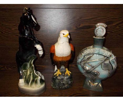 ROYAL DOULTON FISH EAGLE DECANTER 
together with two other decanters one of a horse and the other of the world fair