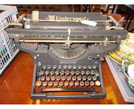 VINTAGE UNDERWOOD TYPEWRITER
with enamel keys and large bar, 48cm long
Note: Fair condition for age