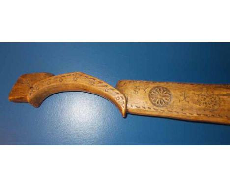19TH CENTURY SWISS FOLK ART CARVED DOUBLE OXEN YOKE
with chip carving, rosettes, intials and mubers87 and 56, 164cm long