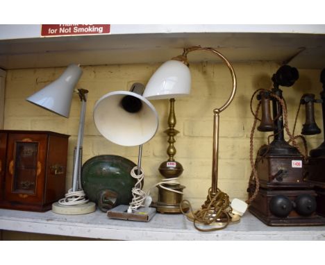 Two vintage table lamps; together with two further brass table lamps; and a pair of green enamel shades.&nbsp; 