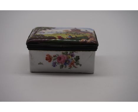 A late 18th century Continental enamel box,&nbsp;the hinged cover painted with figures in a landscape, 9cm wide.&nbsp; 