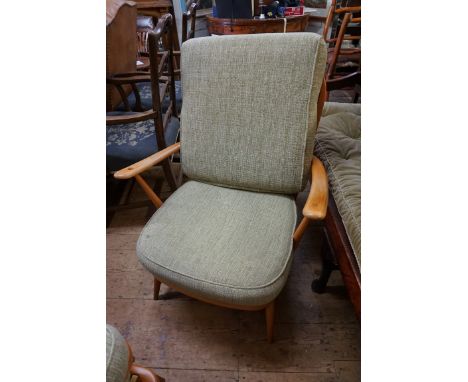 An Ercol armchair;&nbsp;together with a pair of footstools. 