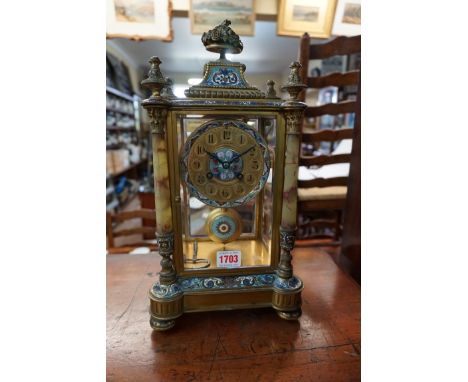 A late 19th century gilt brass, champleve enamel and onyx four glass mantel clock, 38.5cm high, with pendulum and winding key