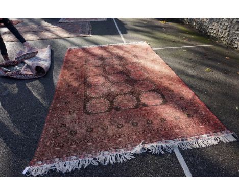 (THH) A Bokhara carpet,&nbsp;having repeated design to central field, with geometric borders, 310 x 202cm. 