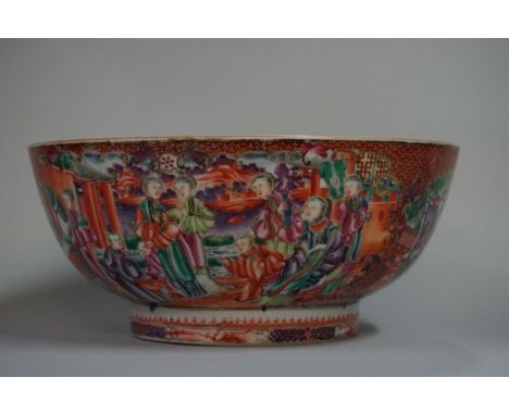 A Chinese Canton famille rose bowl,&nbsp;painted with panels of figures, 28.5cm diameter, (damage and restoration). 
