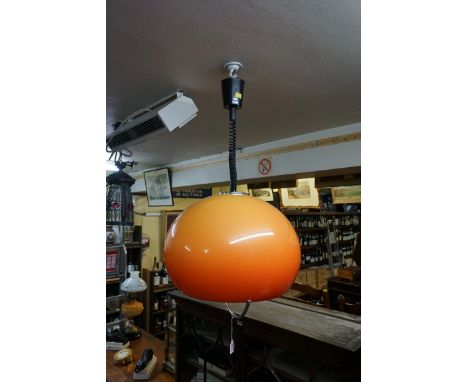 A 1970s Guzzini style orange globe 'rise and fall' ceiling light.&nbsp; 