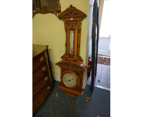 A large and impressive exhibition quality Victorian carved oak wall barometer,&nbsp;by Dollond, London, 141.5cm high. 