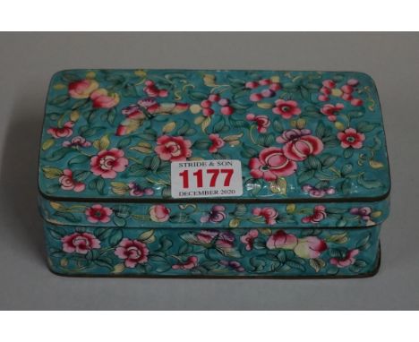 A Chinese enamel rectangular box and cover, decorated with flowers against a blue ground, 15.5cm wide. 