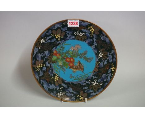 A Japanese cloisonne enamel plate, decorated with quails, 24.5cm diameter. 
