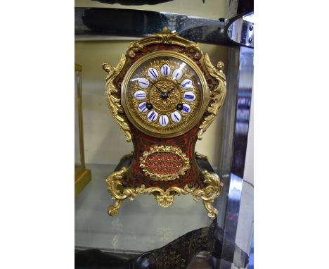 A Louis XV style Boulle mantel clock,&nbsp;the bell striking movement inscribed 'C &amp; S', 25.5cm high, with pendulum and w