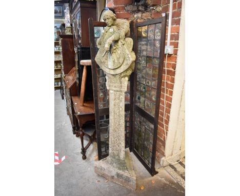 (THH) An old weathered composition stone figural memorial sundial, inscribed with a&nbsp;quote from 'Aurelia' by Rev Greville