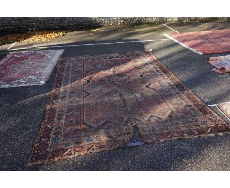 (THH) A large Persian carpet,&nbsp;having three central medallions, with geometric borders, 294 x 208cm. 