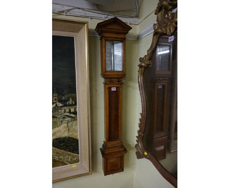 A large Victorian oak stick barometer,&nbsp;by Negretti &amp; Zambra, 109cm high.&nbsp; 