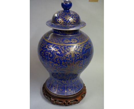 A large Chinese blue and gilt inverted baluster vase and cover,&nbsp;Kangxi six character mark to base,&nbsp;painted with bat