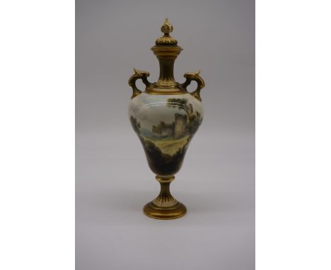 A Royal Worcester twin handled vase and cover,&nbsp;circa 1912, painted with Caerphilli Castle, by C Johnson, 26.5cm high.&nb