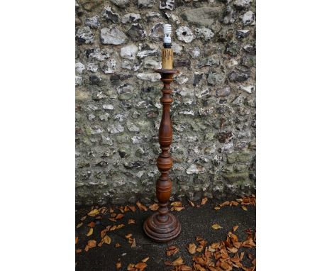 A stained wood standard lamp.&nbsp;This lot can only be collected on Saturday 19th December (9-2pm). 