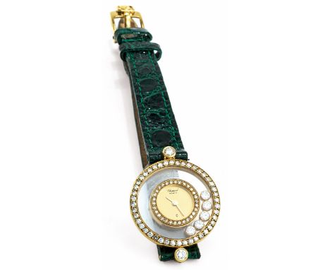 CHOPARD Damenuhr in Gold mit „Happy Diamonds“ Mit Brillanten besetzter Lünette und um das Zifferblatt unter Glas kreisende fü