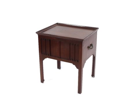 A George III mahogany tray top bedside commode, fitted sliding doors, raised on square section supports terminating in brass 