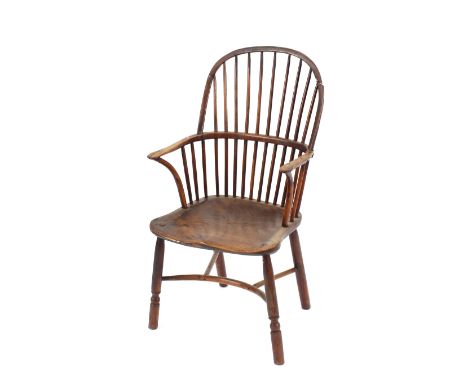 A 19th Century elm and yew wood stick back Windsor chair,&nbsp;the shaped seat raised on turned supports united by a crinolin