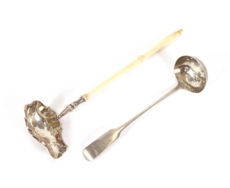 A George III Scottish silver sifter spoon, Edinburgh 1812; and a 19th Century white metal side pouring ladle with turned ivor