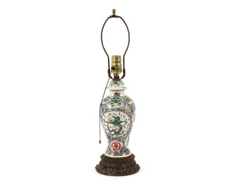 A famille rose decorated baluster table lamp, having gilt metal foliate base, the body decorated with dragons and flowers, 53