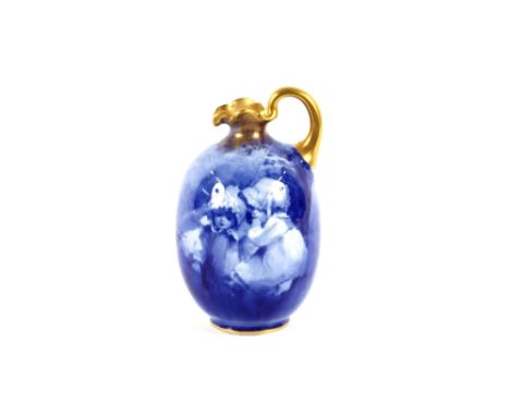 A Doulton Burslem ewer,&nbsp;decorated in blue with scenes of children playing, having gilt handle and flared neck, 16cm high