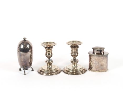 A pair of modern silver dwarf candlesticks, London 1972; a plated tea caddy and an Elkington &amp; Co. plated coddler