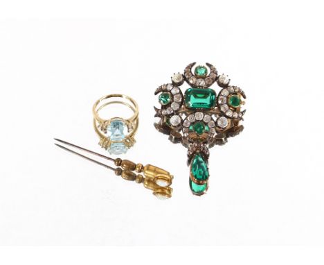 A decorative green and white stone set pendant brooch; an opal set stick pin and a 9 carat gold dress ring set pale blue ston