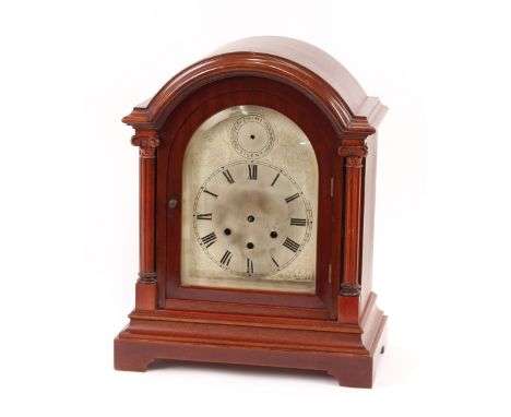 An Edwardian mahogany cased chiming mantel clock, the silvered dial with strike silent subsidiary, 41cm high