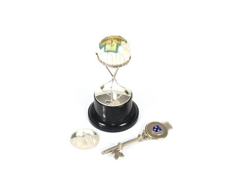 A silver golf trophy, presented by the Dunlop Sports Company Ltd.; a silver Test Cricket centenary medallion, Melbourne Crick