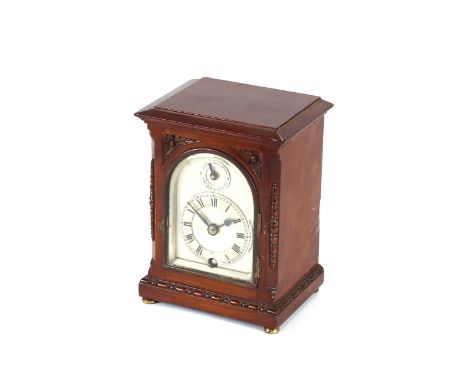 A mahogany cased mantel timepiece,&nbsp;having arched silvered dial, 16.5cm high
