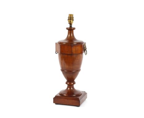 A mahogany baluster vase shaped table lamp, flanked by lion mask ring handles, on square plinth, 42cm high