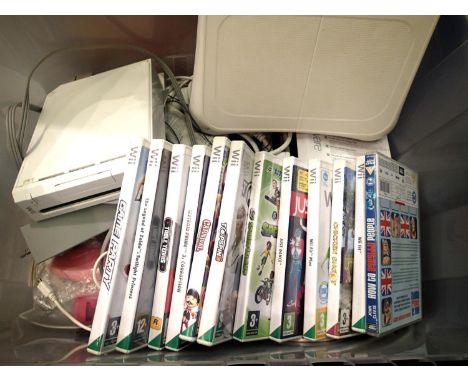 Wii console, leads, balance boards and selection of games. P&amp;P Group 2 (£18+VAT for the first lot and £3+VAT for subseque