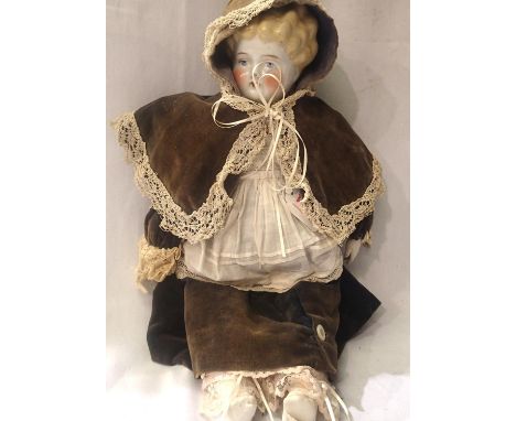 Victorian German doll, H: 50 cm. Clothes are very faded, possible sun damage/age related. Body is ceramic, small damage to no