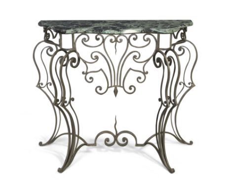 Manner of Gilbert Poillerat&nbsp;Console table, second half 20th century&nbsp;Variegated marble, wrought steel&nbsp;83.5cm hi