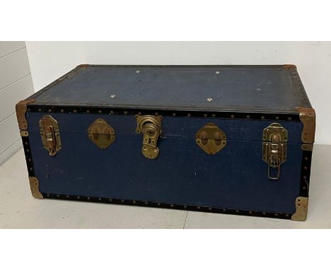 A travel trunk brass bound 