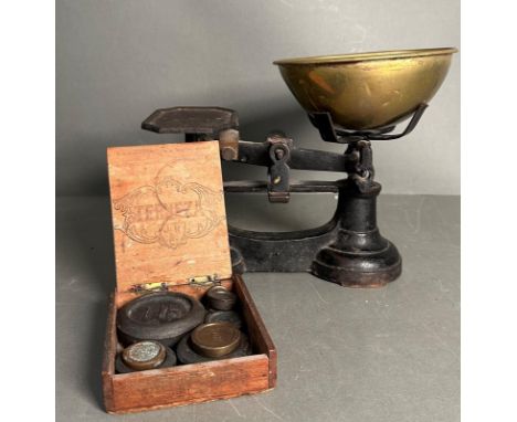 A set of vintage kitchen scales with boxed weights 
