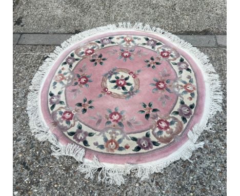 A circular light pink grounds wool rug with floral design (Dia 130cm)Condition Report good condition will need a clean&nbsp;