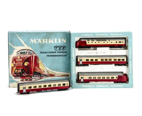 A Märklin HO gauge 3-rail Trans-Europ Express 3-car Diesel Train and extra Coach, a boxed 3-car set ref 3071 in TEE red/cream