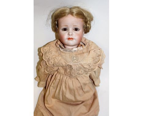 Kammer Reinhardt: A bisque head Kammer Reinhardt girl doll, open eyes, closed mouth, to reverse 'K R 114 W', cream dress, app