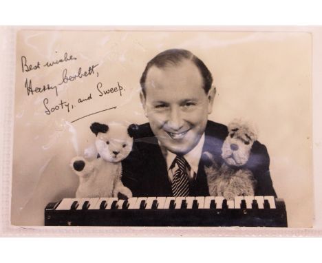 Sooty interest: A black and white photograph of Harry Corbett with Sooty and Sweep, signed by Corbett on the back; "Love to A