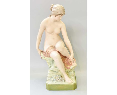 A Royal Dux Figure, modelled as a nude female bather, raised on a naturalistic plinth, applied triangle mark, model 2942, 40c