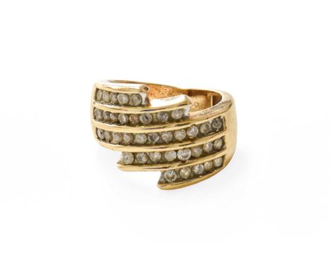 A Diamond Crossover Ring, five rows of round brilliant cut diamonds in yellow channel settings, to a plain polished shank, fi