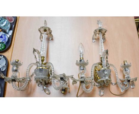 A Pair of George III Style Cut Glass Twin Light Wall Sconces, each ornamented with a central spire with a star finial and orn