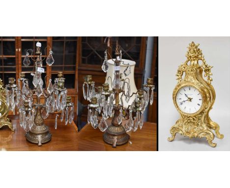 A Pair of Lustre Drop and Gilt Metal Candelabra, eight light, 55cm high; together with a Brass Cased Quartz Mantel Clock (3)