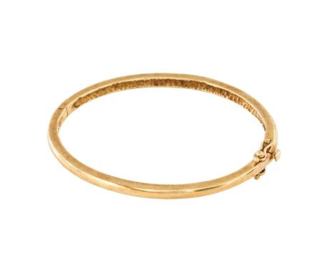 A 9 Carat Gold Hinged Bangle, inner measurements 5.8cm by 5.1cmGross weight 16.8 grams.