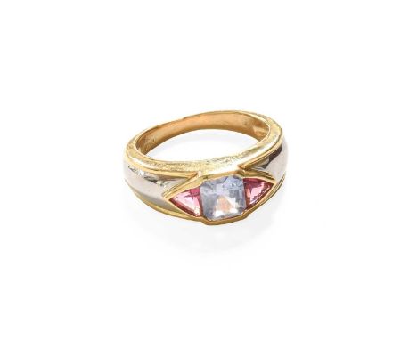 A Multi Gem-Set Ring, the emerald-cut synthetic sapphire flanked by trilliant cut synthetic rubies, in yellow rubbed over set