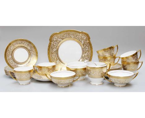 Minton Porcelain Ball Teaset, comprising six cups, saucers and side bowls, sugar bowl, milk jug and bread and butter plate, a