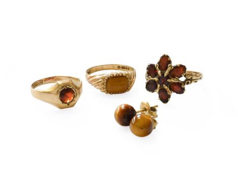 A Small Quantity of Jewellery, comprising of two 9 carat gold garnet rings, finger sizes N and O; a 9 carat gold tiger's-eye 